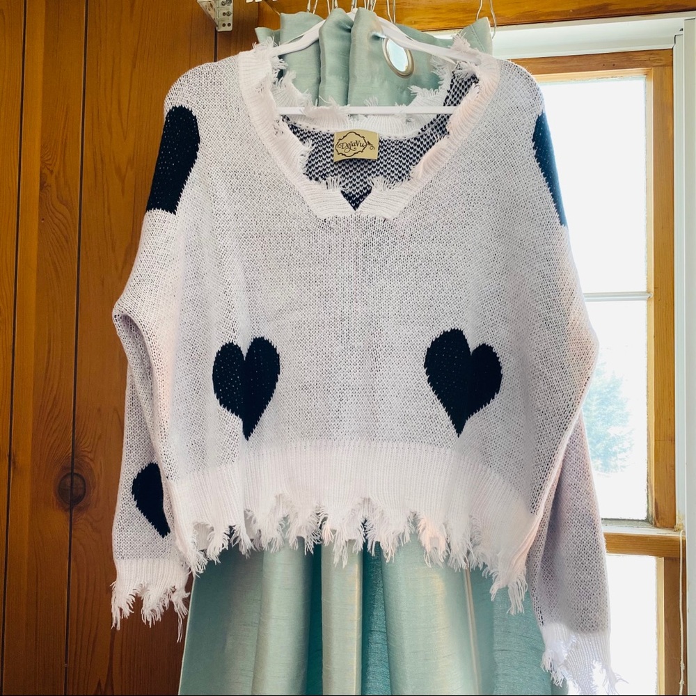 distressed sweater with hearts